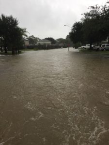 Flooded Houston residential street can be seen after Hurricane Harvey hit Texas. You may be able to claim a casualty loss tax deduction for the damages you suffered.